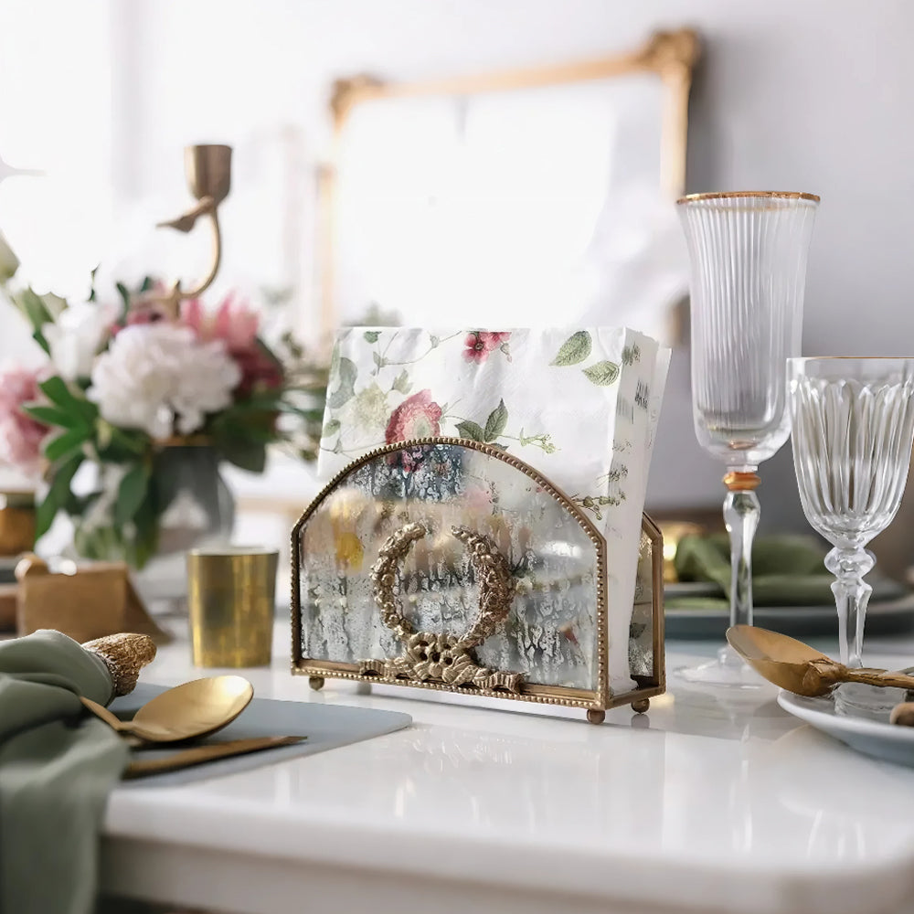 vintage brass carved glass napkin holder storing napkins in the dining table