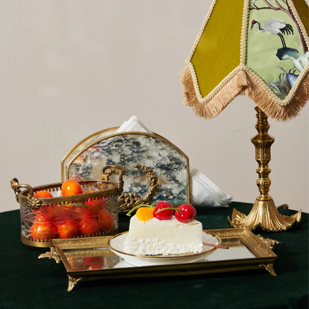 vintage brass carved glass napkin holder storing napkins on the table