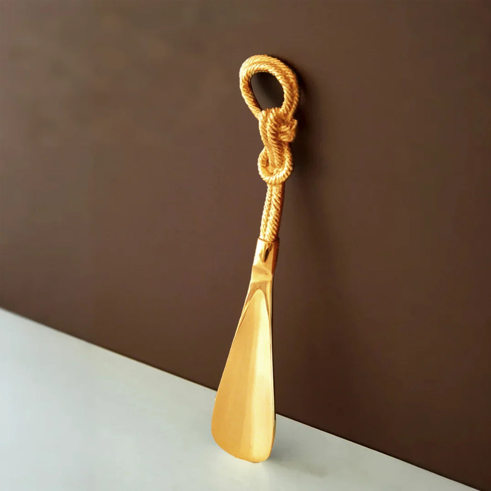 vintage brass golden shoe horn