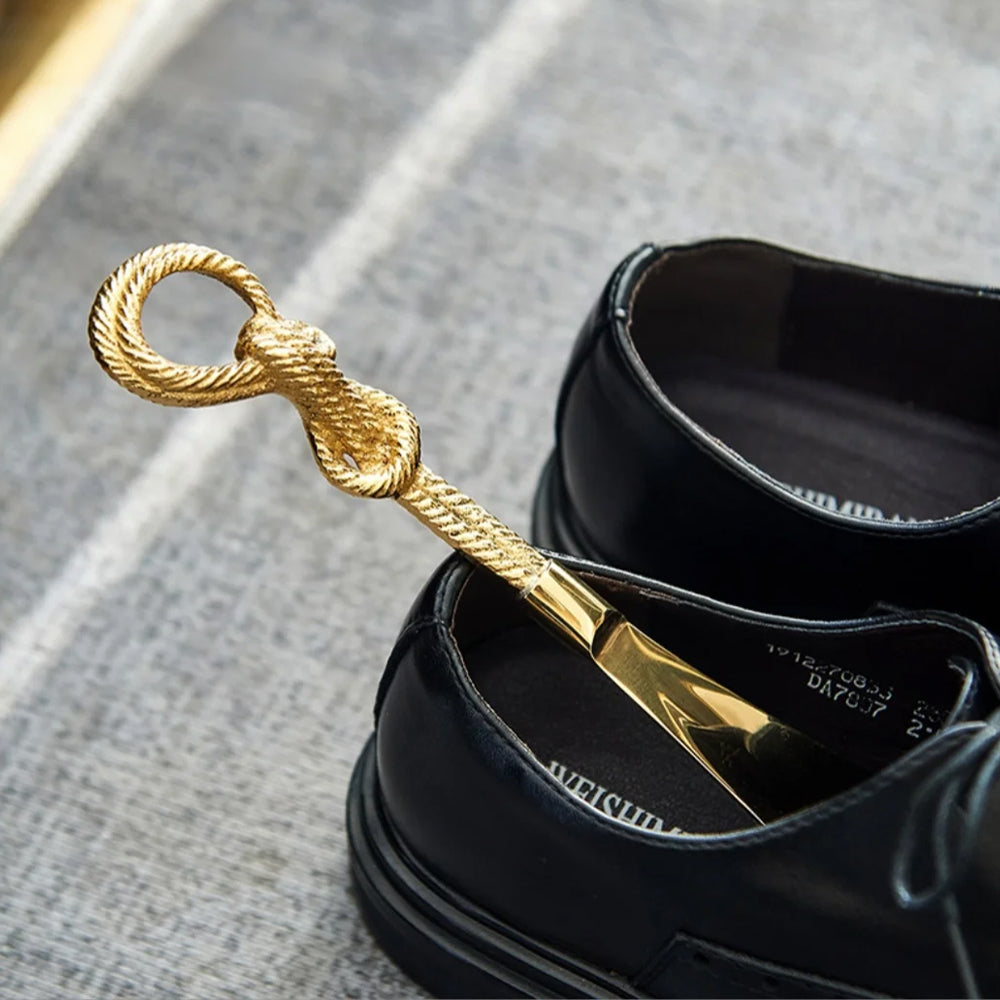 vintage brass golden shoe horn details in the shoes