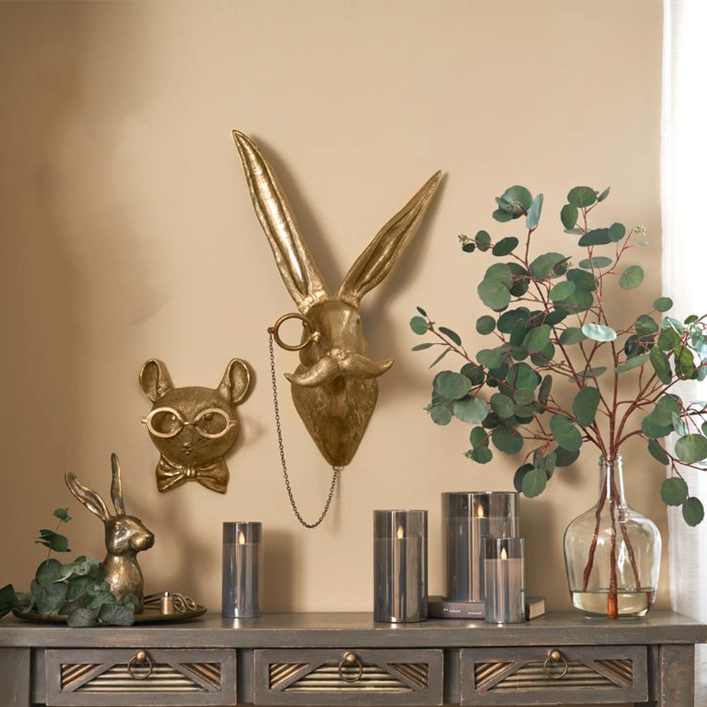 vintage bronze resin animal wall decor above the table