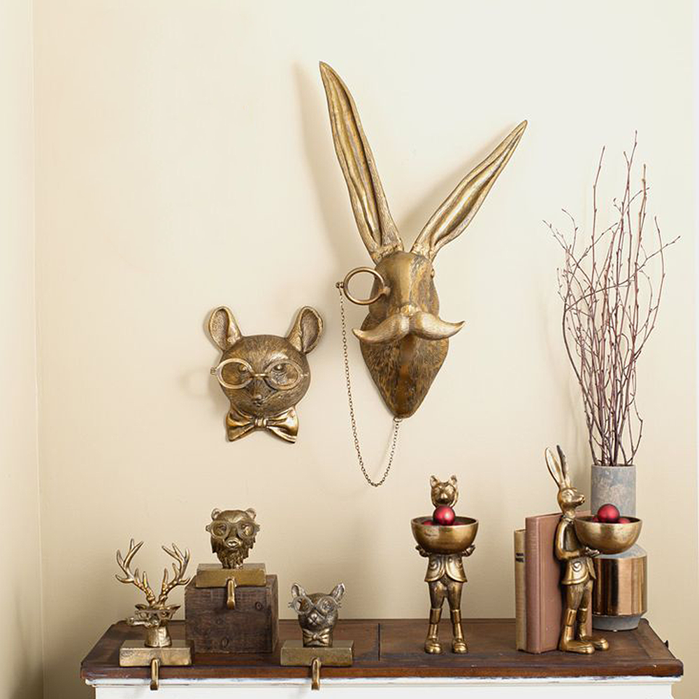 vintage bronze resin animal wall decor above the table