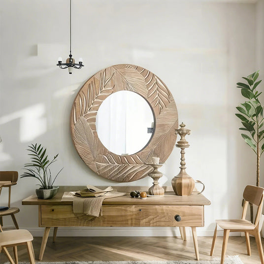 vintage carved wooden round mirror on the wall 