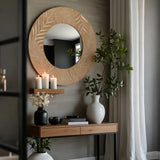 vintage carved wooden round mirror on the wall 