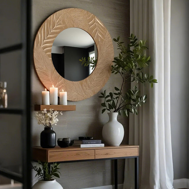 vintage carved wooden round mirror on the wall 