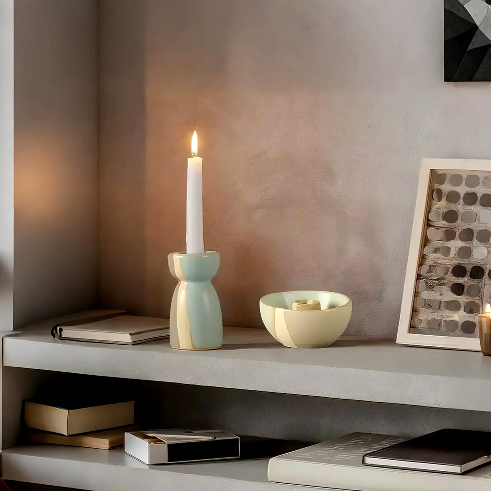 vintage ceramic bicolor decorative candle holders on the cabinet