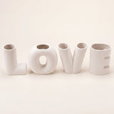 white LOVE letter vases straight on view