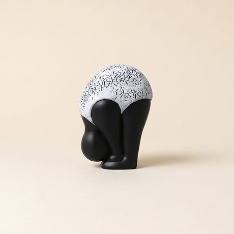 white and black ceramic figurine front view