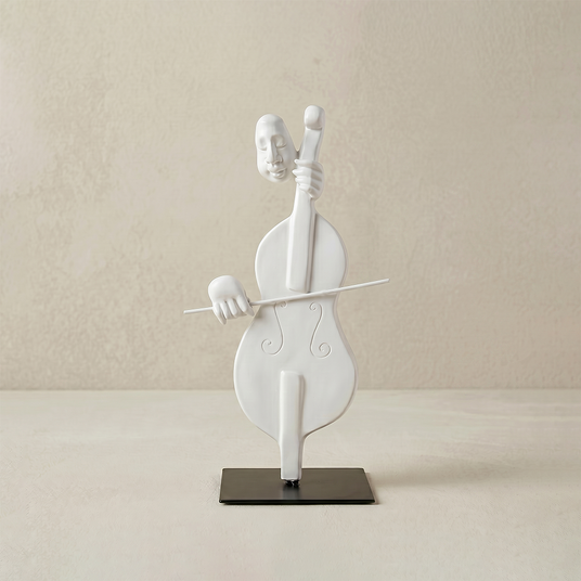 white cello player sculpture on black stand