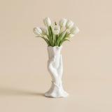 white ceramic hand vase with white tulips