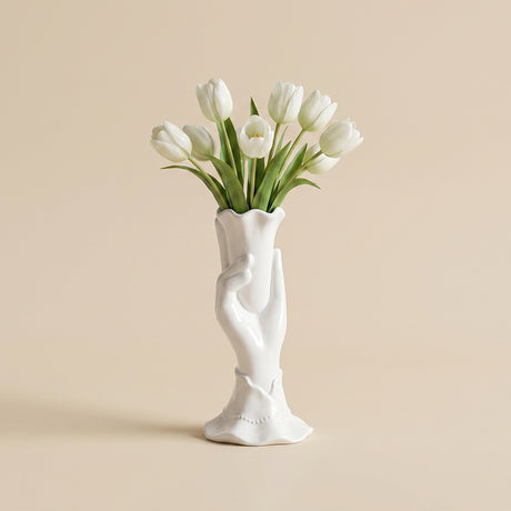 white ceramic hand vase with white tulips