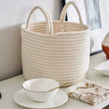 white laundry bakset on the table