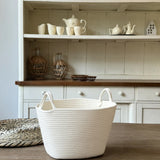 white laundry bakset on the table