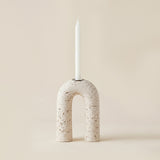 white porous stone arch candle holder