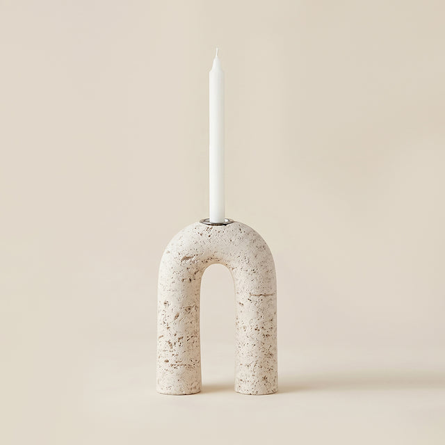 white porous stone arch candle holder