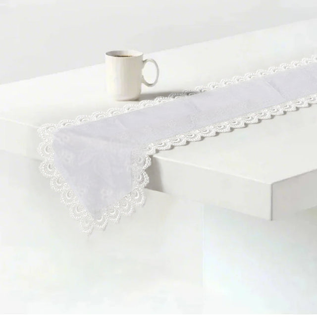 white satin lace table runner on the table