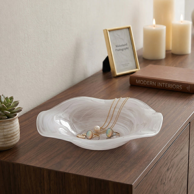 white textured glass jewelry dish on wooden dresser