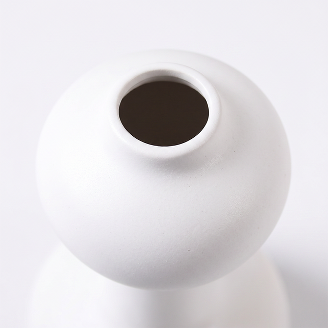 white vase top opening close up