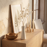 white vase with lunaria on wooden sideboard