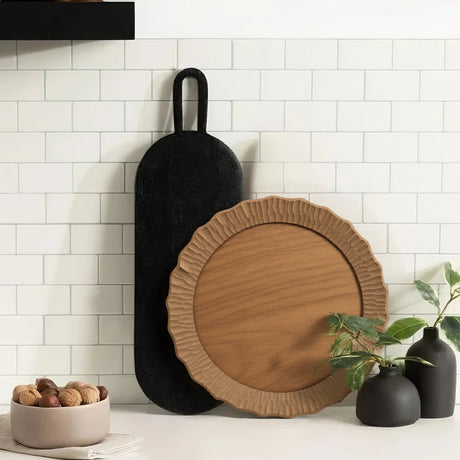 wood serving plate on the kitchen counter