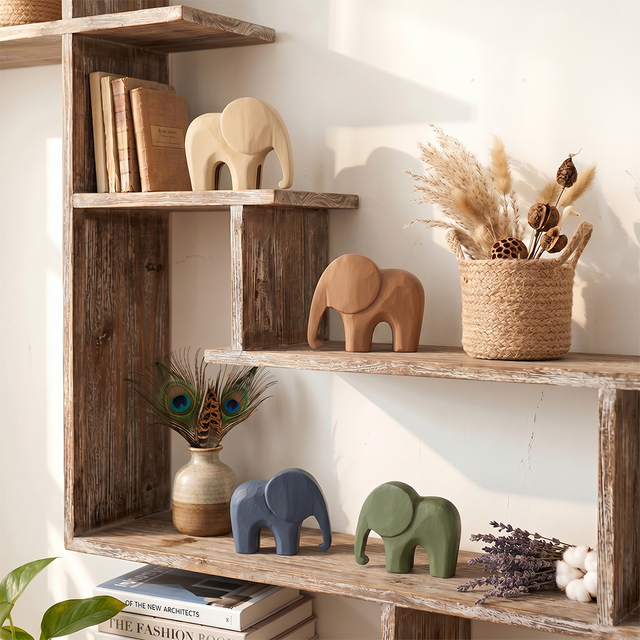 wooden elephants on rustic wooden shelf