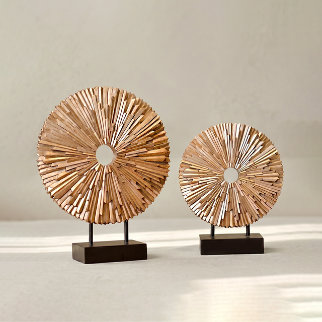 wooden sunburst sculptures on white background