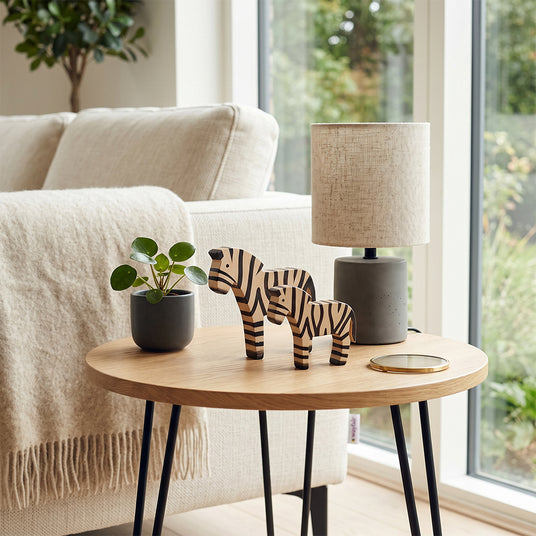 zebra sculpture in white display cabinet
